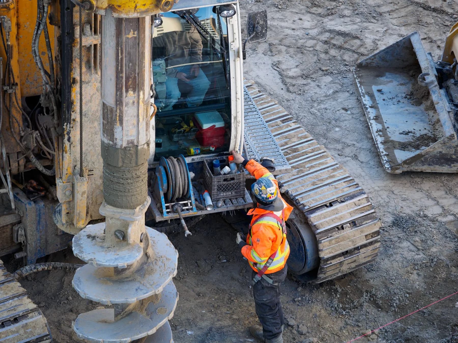 Construction crew operating field equipment during infrastructure work
