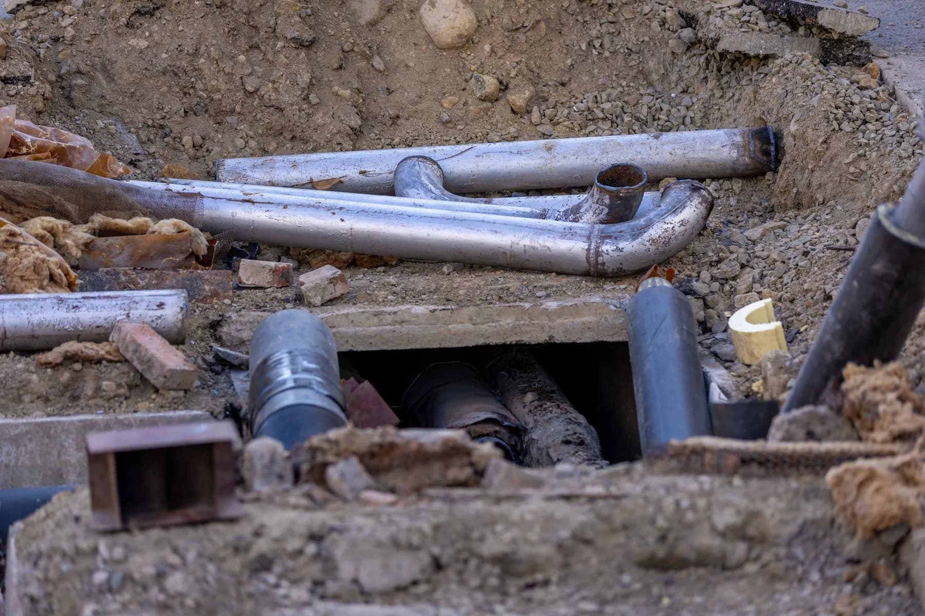 Underground utility pipework at an urban construction site
